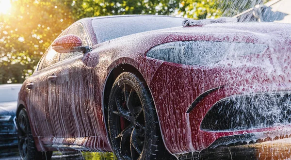 exterior wash and wax water beads on car body